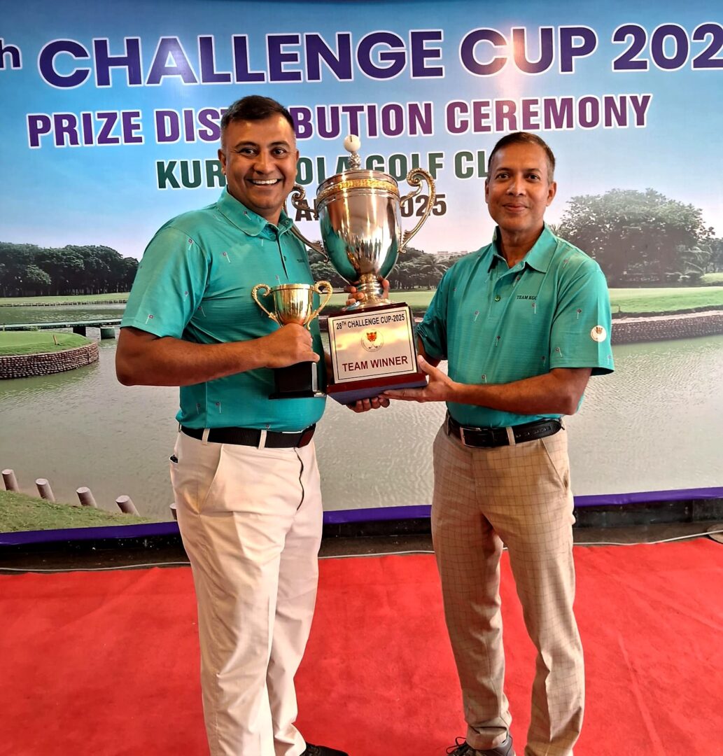 Two members of Kurmitola Golf Club celebrate victory with pride, holding the Team Winner trophy at the 28th Challenge Cup 2025 prize distribution ceremony.