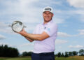 KELSO, SCOTLAND - AUGUST 3: Daniel Young of Scotland poses with the trophy after winning the Farmfoods Scottish Challenge on day four of the Farmfoods Scottish Challenge supported by The R&A 2025 at SCHLOSS Roxburghe on August 3, 2025 in Kelso, Scotland. (Photo by Ross Parker/Getty Images)