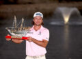 BAHRAIN, BAHRAIN - FEBRUARY 01: Freddy Schott of Germany poses with the trophy on the 18th green following victory on day four of the Bahrain Championship 2026 at Royal Golf Club on February 01, 2026 in Bahrain, Bahrain. (Photo by Warren Little/Getty Images)